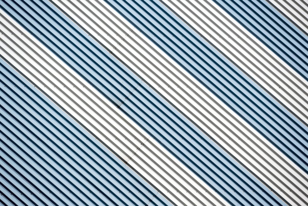Abstract diagonal stripes in metallic tones create a dynamic modern design.