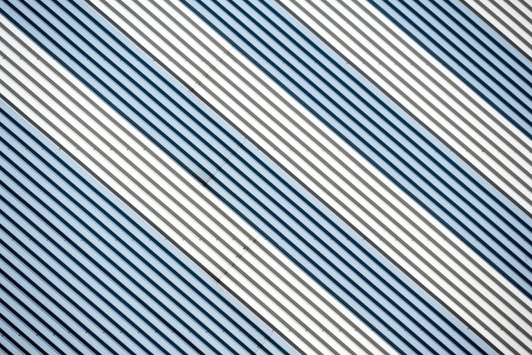 Abstract diagonal stripes in metallic tones create a dynamic modern design.